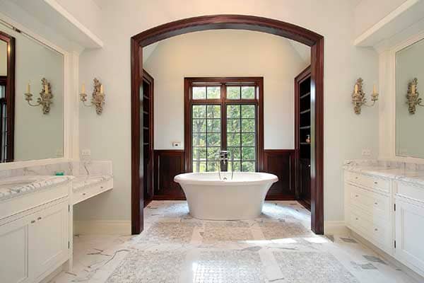 Smart bathroom technology including touchless fixtures, voice controls, and digital mirror displays